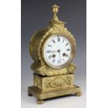 A late 19th century French gilt metal drum dial type mantel clock by A D Mougin, the 10cm white