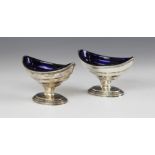 A pair of George III silver salts, marks for 'W.S' London 1785, each of navette form on oval