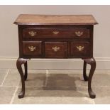 George II oak low boy, the mahogany crossbanded top with canted front corners above an arrangement