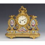 A French Louis XVI style gilt metal and porcelain mantel clock, late 19th century, the 8cm painted