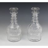 A pair of Georgian cut glass decanters and stoppers, circa 1810, each of mallet form and with banded