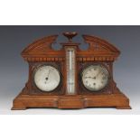 A late Victorian oak cased combination barometer-timepiece, the architectural case enclosing a