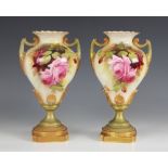 A pair of Royal Worcester blush ivory urns, model number 1959, early 20th century, each of