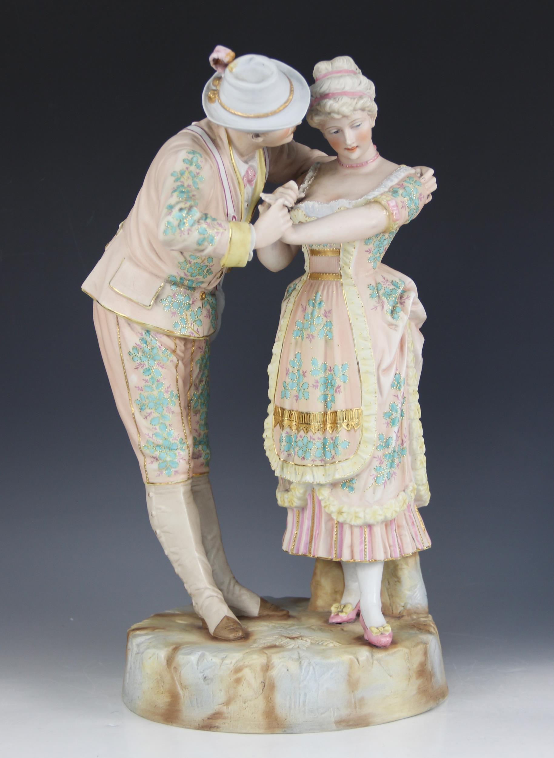 An Austrian bisque figure of a courting couple, early 20th century, gilt highlighted, 42cm high ( - Image 2 of 5