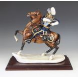 A Michael Sutty figure modelled as a mounted soldier of the 21st Queens Lancers, partial painted