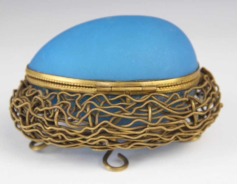 A mid-19th century French etui, modelled as a blue glass egg upon a gilt metal nest raised on four - Image 2 of 4