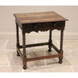 An 18th century and later oak side table, the rectangular plank top with carved detail to the