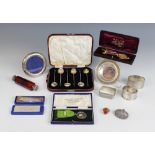 A selection of silver and silver coloured tableware and accessories, to include; a cased set of