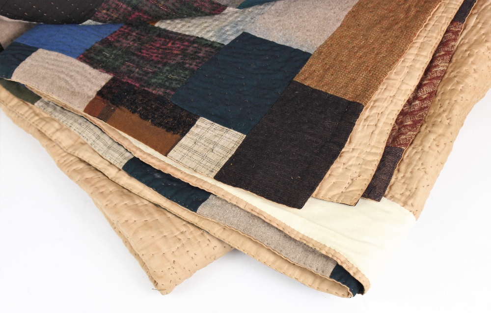 A wool patchwork quilt, late 19th century, made from tailor's scraps in browns, blues, pinks and - Image 3 of 6