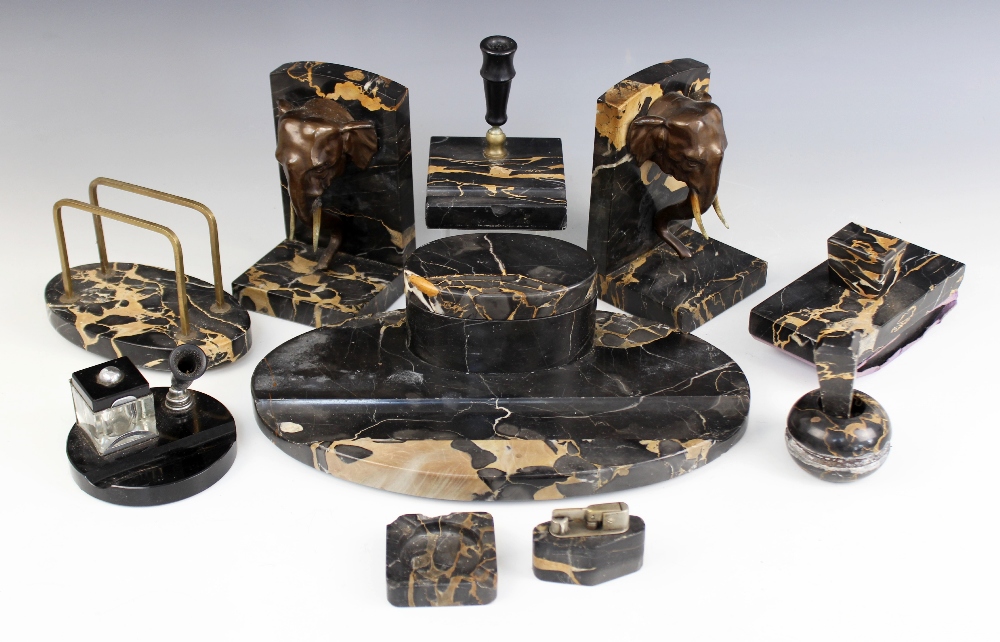 A pair of Art Deco marble bookends, early 20th century, each mounted with a bronze patinated spelter - Image 5 of 5