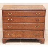 A George III oak chest of drawers, the later top above four long lip moulded and graduated