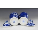 A pair of Chinese porcelain blue and white vases and covers, 19th century, each of baluster form and