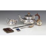 A George III silver toddy ladle, marks for London 1786, oval form bowl with shaped rim set with a