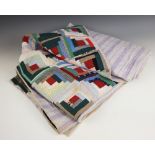 A log cabin pattern patchwork quilt, early 20th century, predominantly in red, green and blue cotton