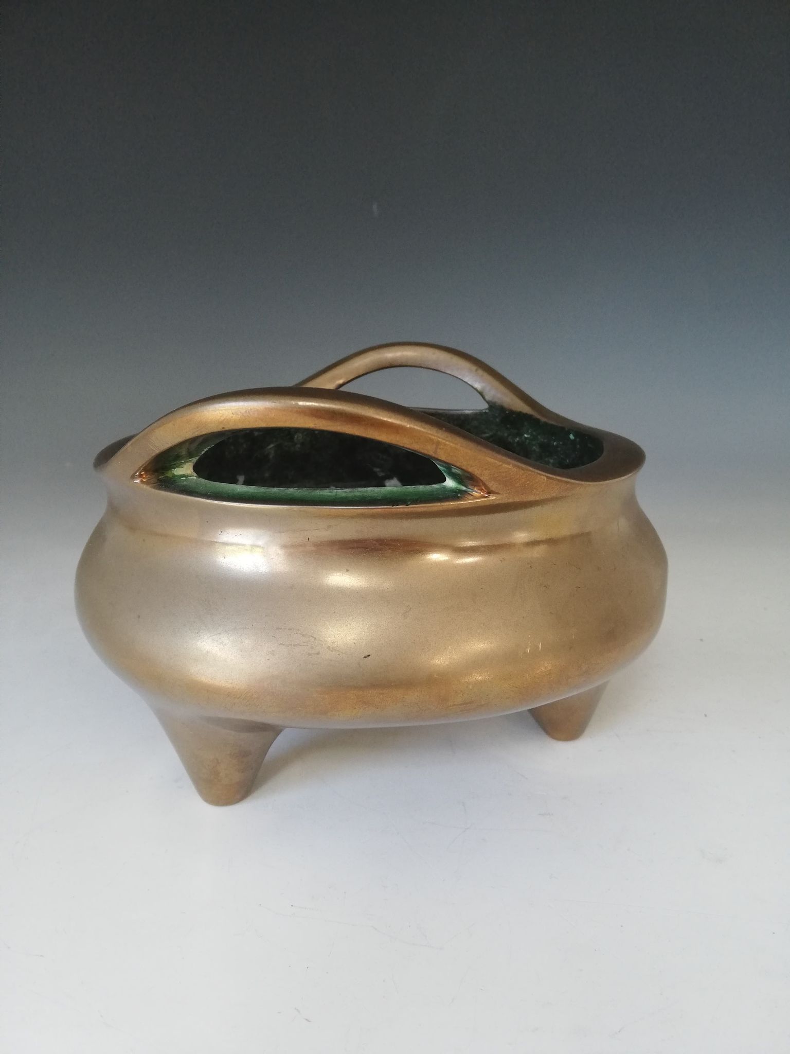 A Chinese polished bronze censer, Xuande mark, of typical plain circular form raised on three legs - Image 12 of 15