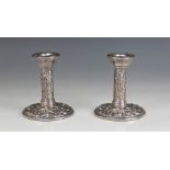A pair of silver mounted desk candlesticks, Broadway & Co, Birmingham 1972, cylindrical columns on