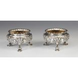 A pair of silver open salts, R & S Garrard & Co, London 1912, each of circular form with gadroon