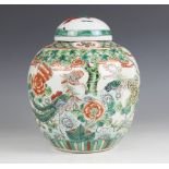 A Chinese porcelain famille vert ginger jar and cover, Kangxi style, 19th century, of ovoid form