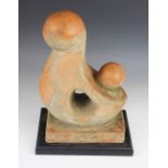 A terracotta sculptural form in the manner of Barbara Hepworth, possibly once a roof or post finial,