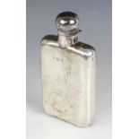 A late Victorian silver hip flask, W & G Neal, London 1899, of curved rectangular form, detachable