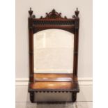 A Gothic Chippendale revival mahogany wall bracket, circa 1900, with a fretwork frieze above a