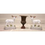 A pair of painted cast iron door porters, each modelled as a stag, each 19cm wide and 21cm high,