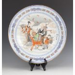 A large Chinese porcelain charger, Jingdezhen Zhi, 20th century, centrally decorated with figures
