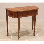 A George IV style mahogany side table, late 20th century, the bow front flame mahogany veneered