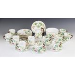 A porcelain coffee service, each piece decorated with blackberry and bramble sprays, the cups with