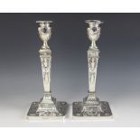 A pair of George V neo-classical silver candlesticks, Ellis & Co, Birmingham 1914, each weighted