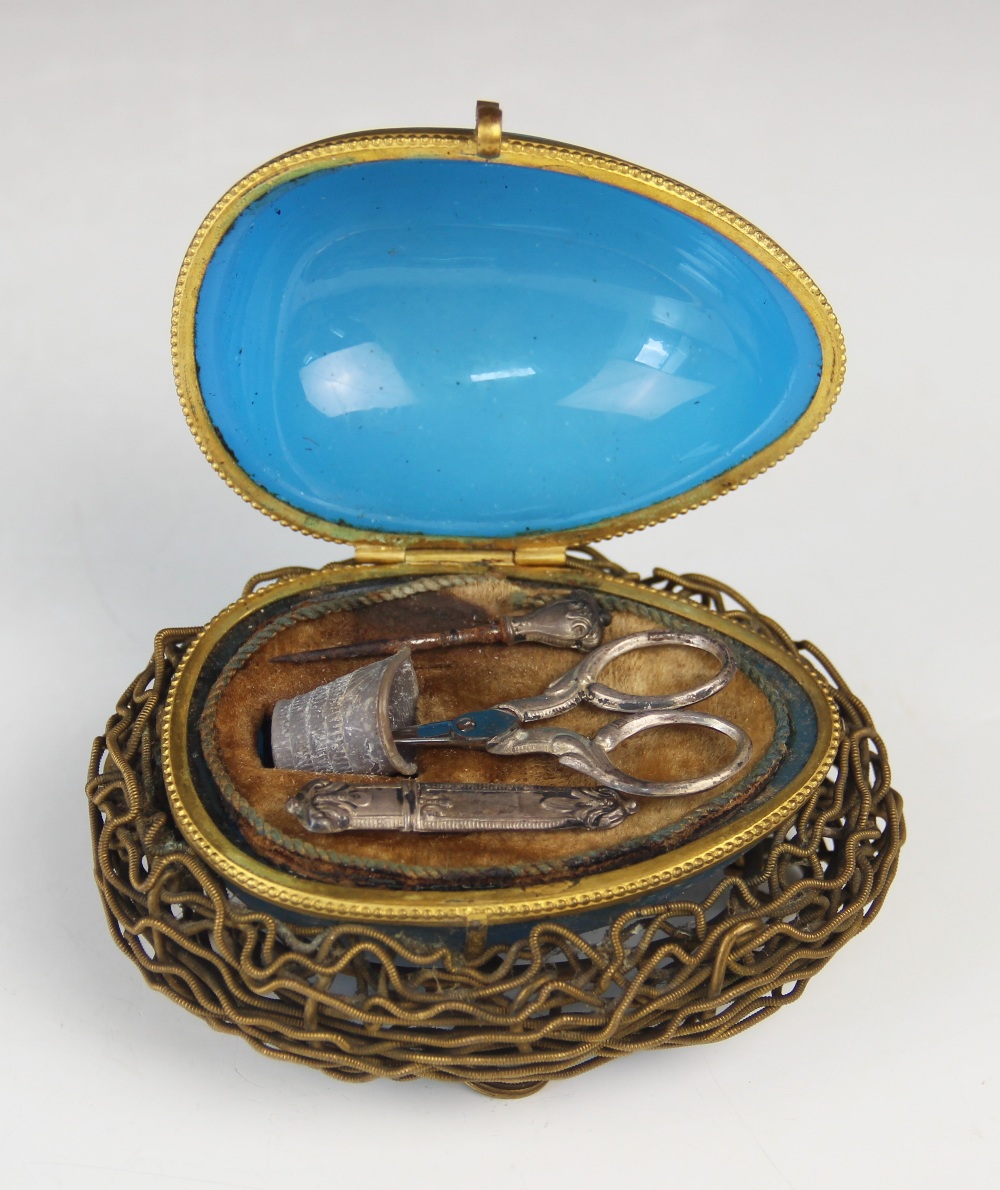 A mid-19th century French etui, modelled as a blue glass egg upon a gilt metal nest raised on four - Image 3 of 4