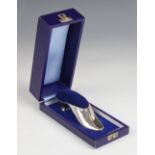 A novelty silver pin cushion, A Marston & Co, Birmingham 1979, modelled as a shoe with blue velvet