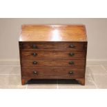 A George III mahogany bureau, the fall front opening to a compartmentalised interior over four