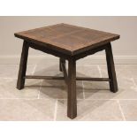 An Arts & Crafts oak draw leaf table, purchased from Liberty, the rectangular draw leaf top above