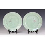 A pair of Chinese celadon ground plates, 20th century, each slip decorated with white floral sprays,