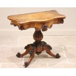 A Victorian figured walnut pedestal card table, the serpentine book veneered top opening to a