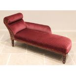 A late Victorian walnut chaise longue, later re-covered in red velour fabric, the padded scroll