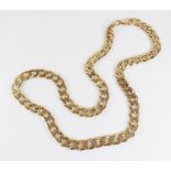 A gold coloured chain, the flat curb link chain with lobster claw and loop fastening, claw marked '