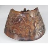 A horse's hoof, relief carved with Chinese figures in a landscape, 12cm W x 13cm D x 6.5cm H