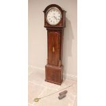 A George III mahogany cased eight day longcase clock, the arched hood with inlaid Prince of Wales