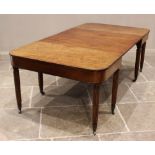 A George III mahogany dining table, comprising a pair of 'D' end tables and two leaves all with a