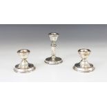 A pair of silver mounted desk candlesticks, Broadway & Co, Birmingham 1967, tapered sconces with