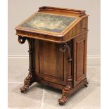 An early Victorian rosewood davenport, the three quarter gallery above a skiver inset writing slope,