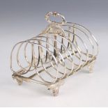 A William IV silver six division toast rack, Joseph Angell I & John Angell I, London 1835, the