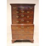 A George III mahogany chest on chest, with a moulded dentil cornice over three short and three