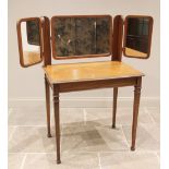 An Edwardian mahogany dressing table, the triple mirror arrangement over a rectangular moulded