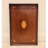 An Edwardian mahogany galleried tray, the inlaid boxwood bat wing oval enclosed by conforming