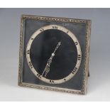 A silver plated desk clock by Goldsmiths & Silversmiths Company, the square face set with circular