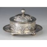 A Chinese silver coloured butter dish, of circular form with detachable cover and circular stand