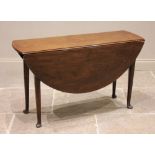 A George II mahogany drop leaf table, the oval top raised upon tapering cylindrical legs and pad
